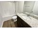 Bathroom featuring a tub/shower combo, single sink, and granite countertops at 138 Sourgum Ct, Zebulon, NC 27597
