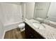 Bathroom featuring a white vanity, granite counters, white toilet and shower/tub combo at 138 Sourgum Ct, Zebulon, NC 27597