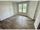 Bright bedroom featuring wood floors and a double window for natural light at 138 Sourgum Ct, Zebulon, NC 27597