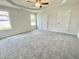 Spacious bedroom featuring plush carpet, a ceiling fan, and plenty of natural light at 138 Sourgum Ct, Zebulon, NC 27597
