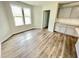 Eat-in-kitchen featuring gray cabinets, and wood-look floors at 138 Sourgum Ct, Zebulon, NC 27597