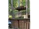 Picturesque backyard showcasing a custom-built treehouse, blending nature and recreation at 14 Striding Ridge Ct, Durham, NC 27713