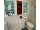 Bright bathroom featuring a window and combined tub and shower for a refreshing experience at 14 Striding Ridge Ct, Durham, NC 27713