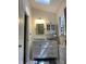 Well-lit bathroom features a vanity, mirror, medicine cabinet and a window at 14 Striding Ridge Ct, Durham, NC 27713