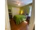Comfortable bedroom features green walls, hardwood floors, and a ceiling fan at 14 Striding Ridge Ct, Durham, NC 27713