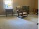 Bedroom with rocking chair by window and a calm and relaxing ambiance at 14 Striding Ridge Ct, Durham, NC 27713