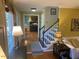 Inviting entryway featuring hardwood floors, staircase, and natural light from large windows at 14 Striding Ridge Ct, Durham, NC 27713