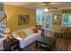 Cozy living room with hardwood floors, lots of light, and a comfortable seating area at 14 Striding Ridge Ct, Durham, NC 27713
