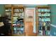 Cozy living room with wooden bookcases and a view into the kitchen with hardwood flooring at 14 Striding Ridge Ct, Durham, NC 27713