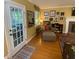 Living room featuring access to the exterior, a fireplace, and hardwood floors at 14 Striding Ridge Ct, Durham, NC 27713