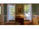 Bright and functional office space featuring built-in desk, dual windows with green paint, and natural light at 14 Striding Ridge Ct, Durham, NC 27713