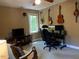 Well-lit office space decorated with guitars, providing a creative atmosphere at 14 Striding Ridge Ct, Durham, NC 27713