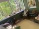 Relaxing screened porch featuring cozy seating and a peaceful outdoor view at 14 Striding Ridge Ct, Durham, NC 27713