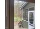 Cozy screened porch with a view of the wooded backyard, offering a serene outdoor living space at 14 Striding Ridge Ct, Durham, NC 27713