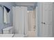 Bathroom featuring toilet, shower/tub with a white shower curtain at 148 Shadowbrook Dr, Henderson, NC 27537
