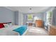 Bedroom featuring a light blue painted walls, carpet floor and a window at 148 Shadowbrook Dr, Henderson, NC 27537