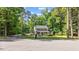 Charming home with a welcoming front porch, well-maintained lawn, and mature trees at 148 Shadowbrook Dr, Henderson, NC 27537