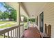 Welcoming front porch featuring brick flooring, ample space, and scenic outdoor views at 148 Shadowbrook Dr, Henderson, NC 27537
