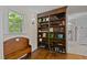 Hallway nook with stylish shelves and a bench. Perfect for extra storage! at 148 Shadowbrook Dr, Henderson, NC 27537