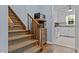 Stairway featuring carpet runner and decorative wood microwave stand at 148 Shadowbrook Dr, Henderson, NC 27537