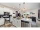 A modern kitchen with white cabinets, granite countertops, and stainless steel appliances at 152 Briar Den Ct, Benson, NC 27504