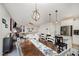 Open-concept living room with hardwood floors, an area rug, and a decorative light fixture at 152 Briar Den Ct, Benson, NC 27504