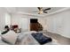 Spacious bedroom with neutral carpet, tray ceilings, and ample natural light at 152 Briar Den Ct, Benson, NC 27504