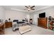 Comfortable bedroom featuring plush carpet, a ceiling fan, and neutral tones at 152 Briar Den Ct, Benson, NC 27504