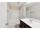 Bathroom featuring a modern vanity and combination shower and tub with tile backsplash at 1600 Tinos Overlook Way, Apex, NC 27502