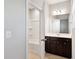 Bathroom view showcasing a tub and shower combo adjacent to the vanity at 1600 Tinos Overlook Way, Apex, NC 27502