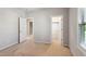 Bedroom showcasing several open doorways and a large window at 1600 Tinos Overlook Way, Apex, NC 27502