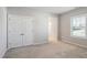 Bedroom showcasing a large closet and window, providing ample storage and light at 1600 Tinos Overlook Way, Apex, NC 27502