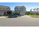 Charming two-story home with a two-car garage, blue accents, and a well-maintained front yard at 1600 Tinos Overlook Way, Apex, NC 27502