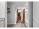Updated bathroom with a shower/tub combo featuring neutral colors and shelving for extra storage at 165 Bywood Dr, Roxboro, NC 27573