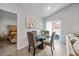 Bright dining area with modern décor, seating for four, and sliding glass doors to the outside at 165 Bywood Dr, Roxboro, NC 27573