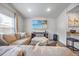 Living room with a neutral color palette, large comfortable seating, and a flat screen television at 165 Bywood Dr, Roxboro, NC 27573
