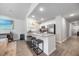 Open-concept living room and kitchen with granite counters, stainless appliances, and barstool seating at 165 Bywood Dr, Roxboro, NC 27573
