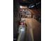 Unfinished attic space with exposed rafters and plywood flooring at 1655 Kingfisher Ct, Nashville, NC 27856