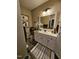Cozy bathroom with decorative accents, including a plush rug and stylish lighting at 1655 Kingfisher Ct, Nashville, NC 27856
