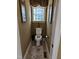 Small powder room with a window at 1655 Kingfisher Ct, Nashville, NC 27856