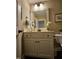 Bright bathroom features vanity, mirror, cabinets, and neutral decor at 1655 Kingfisher Ct, Nashville, NC 27856