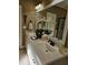 Bathroom with double sinks and a large mirror at 1655 Kingfisher Ct, Nashville, NC 27856