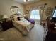 Cozy bedroom featuring decorative elements and a large window at 1655 Kingfisher Ct, Nashville, NC 27856