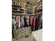 Spacious walk-in closet with organized shelving and hanging racks for ample storage at 1655 Kingfisher Ct, Nashville, NC 27856