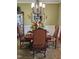 Dining room featuring a decorative chandelier and table setting at 1655 Kingfisher Ct, Nashville, NC 27856