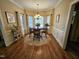 Dining room with hardwood floors and natural light from the large window at 1655 Kingfisher Ct, Nashville, NC 27856