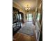 Inviting foyer with hardwood floors, elegant chandelier, and glass-paneled doors at 1655 Kingfisher Ct, Nashville, NC 27856
