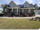 Beautiful brick home with a water feature and attractive landscaping at 1655 Kingfisher Ct, Nashville, NC 27856