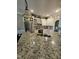 This kitchen boasts granite countertops, stainless steel appliances, and custom cabinetry at 1655 Kingfisher Ct, Nashville, NC 27856