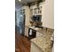 Kitchen showcasing white cabinets, granite countertops, and stainless steel appliances at 1655 Kingfisher Ct, Nashville, NC 27856